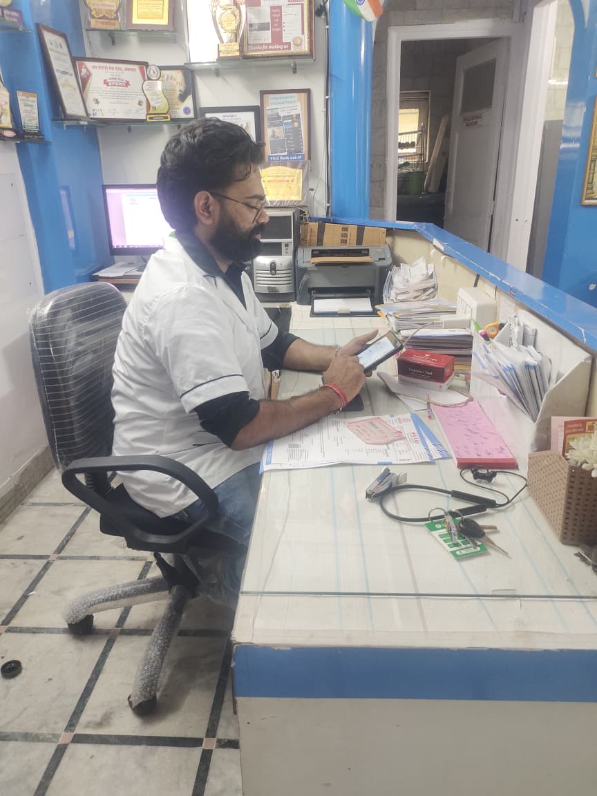 Om Lab Team Member Assisting Patients At Reception